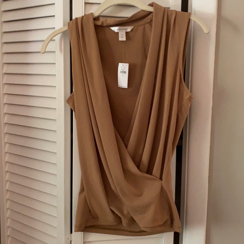 Tan colored top open front sleeveless